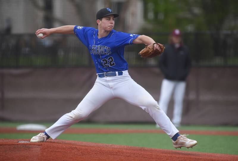 St. Francis pitcher Peter Lemke throws to a Wheaton Academy batter during Tuesday’s baseball game in West Chicago.