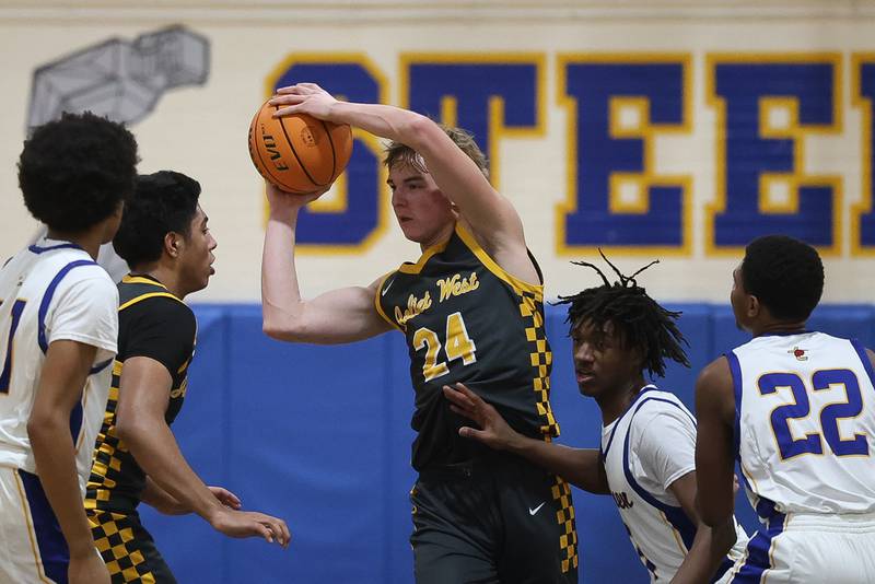 Joliet West’s Ryan Lipke pulls in the rebound against Joliet Central on Thursday, Jan. 15, 2026 in Joliet.