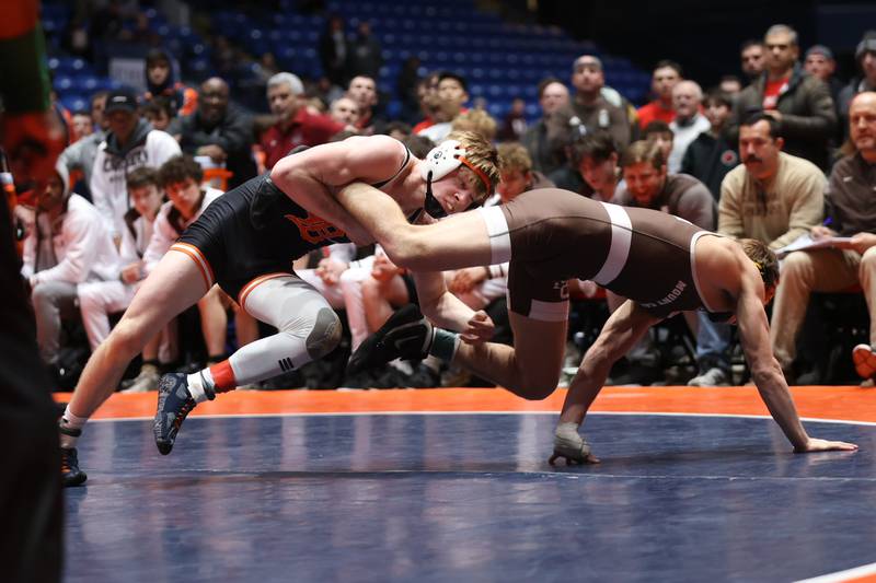 DeKalb’s Austin Martin throws Mount Carmel’s Sergio Lemley in the Class 3A 138 pound dual team championship match at Grossinger Motor Arena in Bloomington. Saturday, Feb. 26, 2022, in Champaign.