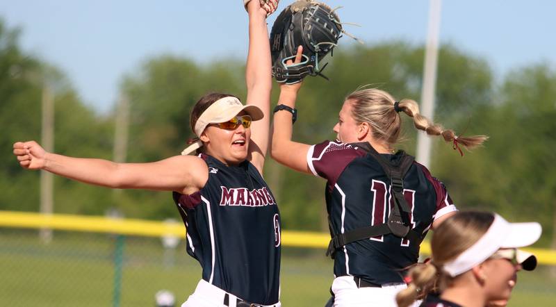 Marengo’s Gabrielle Gieseke, left, and Kylee Jensen  exit the field to conclude an inning Against Aurora Central Catholic in IHSA Class 2A Regional Title Game action softball at Marengo High School in Marengo on Friday, May 23, 2025.