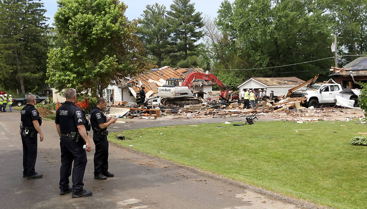 Authorities look for the cause of a home explosion on Monday, May 18, 2026, in 7400 block of Birch Drive, in Wonder Lake, after the Sunday evening explosion. One resident of a home was killed and two others have been taken to the hospital.