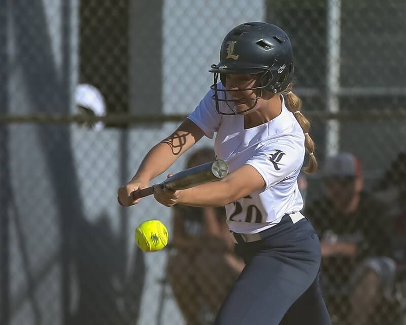 Lemont's Olivia Parent (20) bunts during Class 3A Joliet Catholic Sectional final game between Marian Catholic at Lemont.  June 3, 2022.