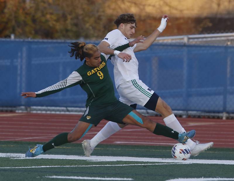 Crystal Lake South's Ali Ahmed battles for control of the ball against Peoria Notre Dame's Thomas Graham during the IHSA Class 2A state championship soccer match on Saturday, Nov. 4, 2023, at Hoffman Estates High School.