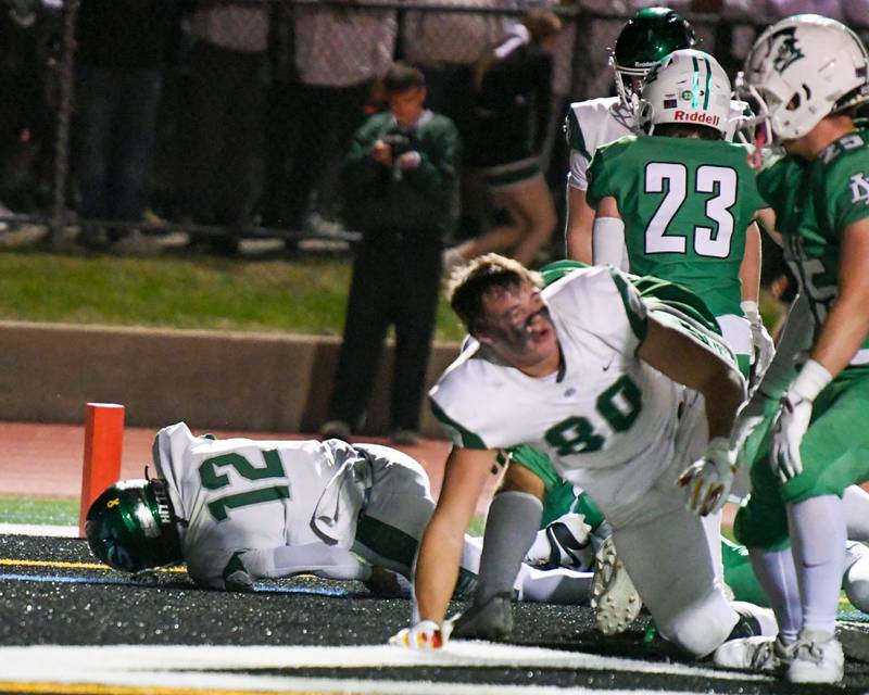Glenbard West's AJ Rayford (12) gets into the endzone for a touchdown during the game on Friday Oct. 17, 2025, while traveling to take on York High School.