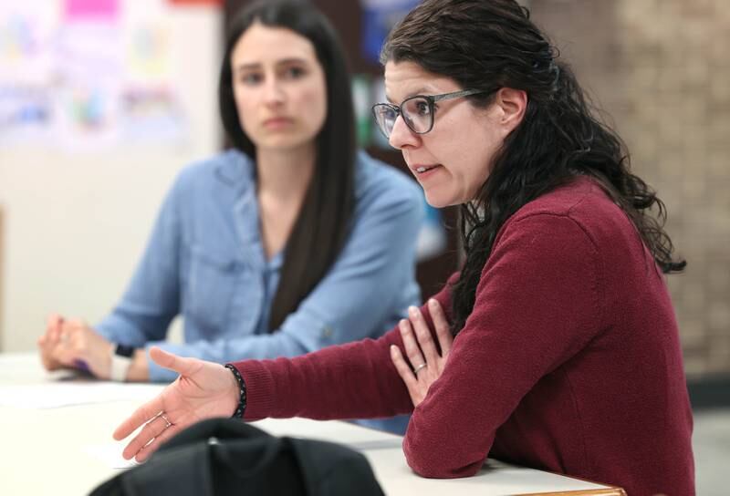 Kortney Flowers, (right) a speech language pathologist at Huntley Middle School, talks about her job Wednesday April 24, 2024, as Sarah Schneeman, a speech language pathologist at Cortland Elementary School, looks on at Huntley Middle School in DeKalb.