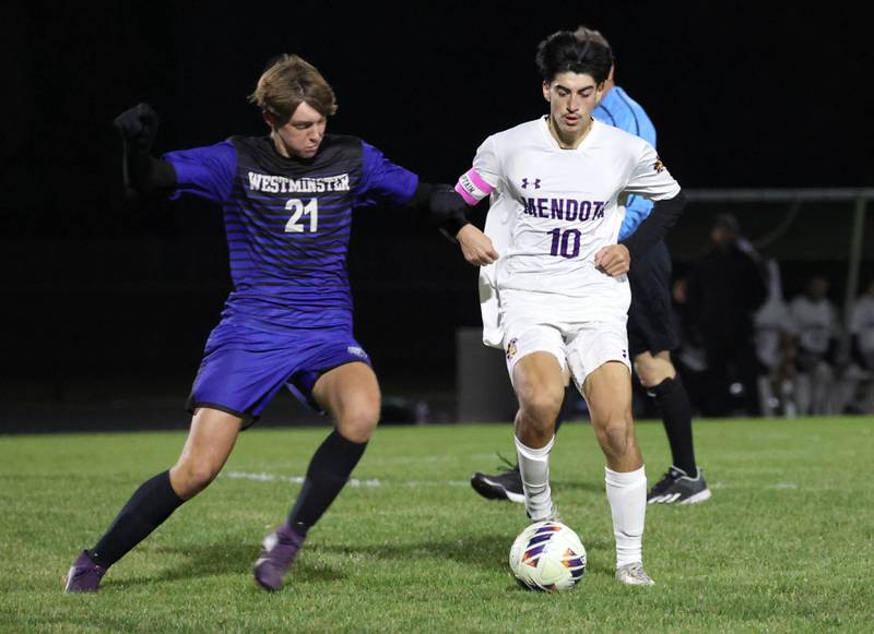 Harvest-Westminster's Miles Meurer and Mendota's Johan Cortez go after a loose ball Friday, Oct. 31, 2025, during the Class 1A Indian Creek Sectional championship game Friday in Waterman.