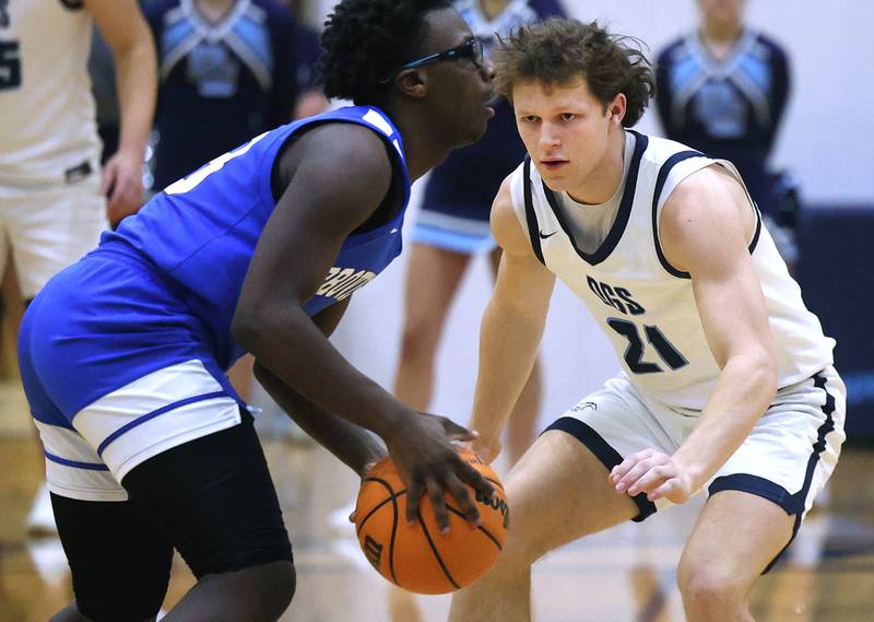 Downers Grove South's Daniel Laurich guards Proviso East's Taysean Webster during their game Friday, Feb. 14, 2025, at Downers Grove South High School.