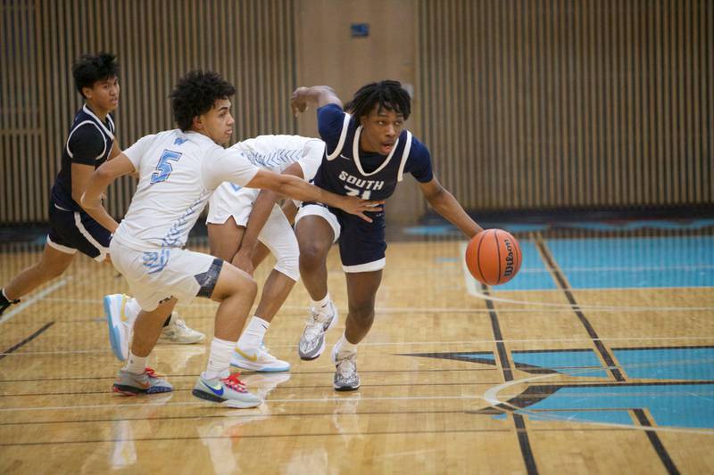 Downers Grove South's Jeremiah Darlin picks up the loose ball to advance past Willowbrook's Feim Alka on Friday, Feb.2,2024 in Villa Park.