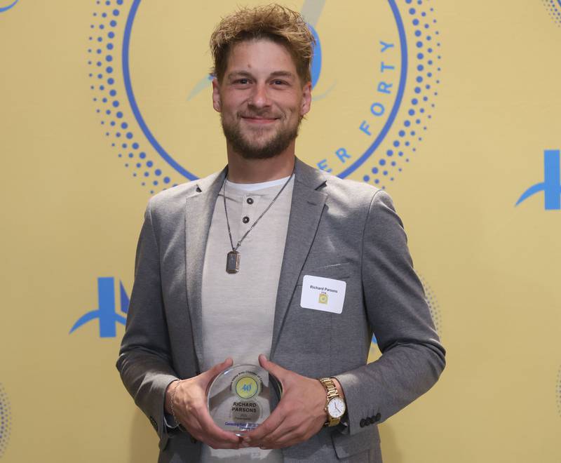 Richard Parsons poses with his 40 Under Forty award during the Illinois Valley Chamber of Commerce Champions of Change Awards Night on Wednesday, May 6, 2026 at the Westclox Event Center in Peru.