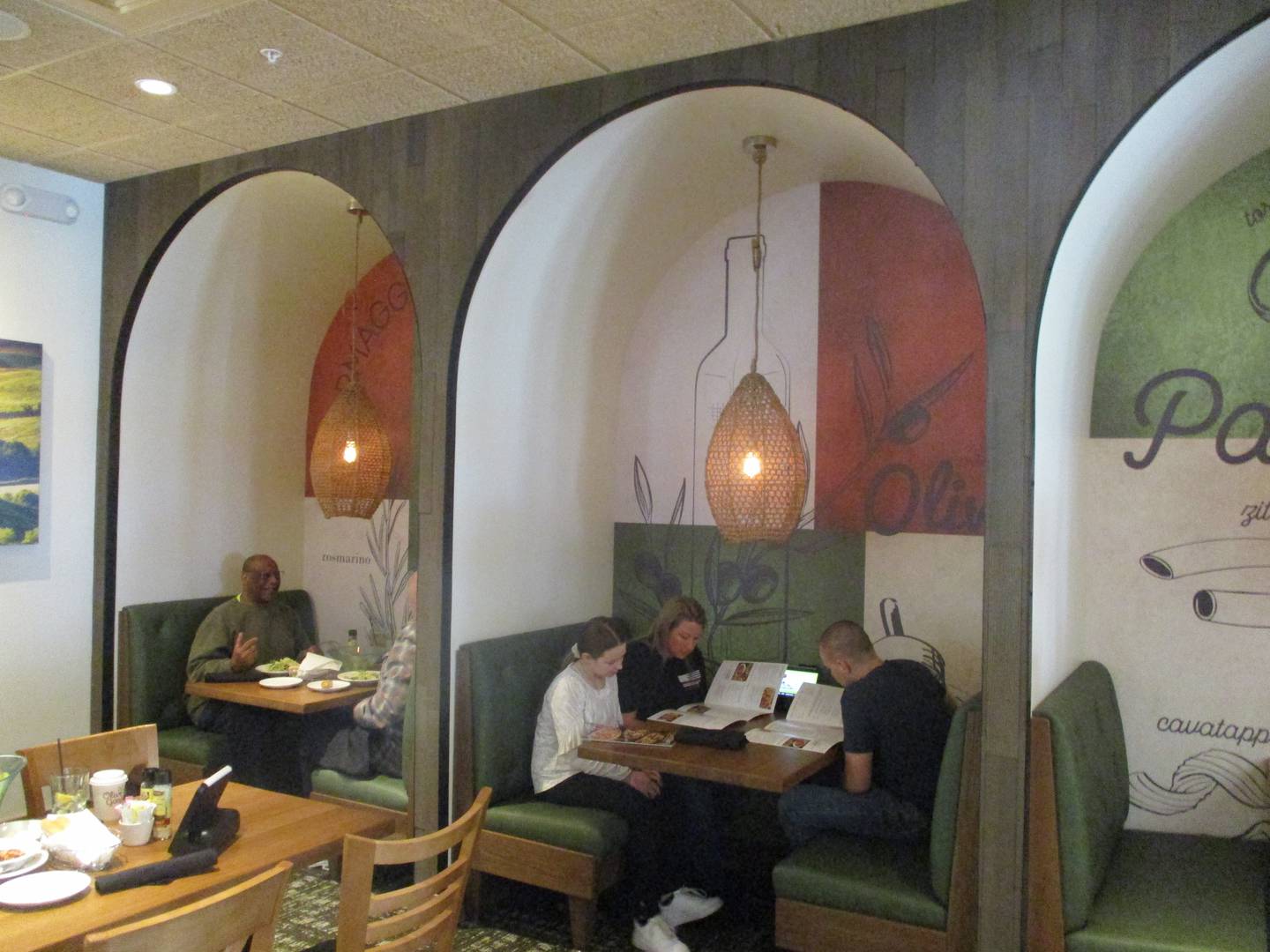 Booths offering more seclusion and privacy is one of the features of the Olive Garden Restaurant that opened Monday in Joliet. April 10, 2023.