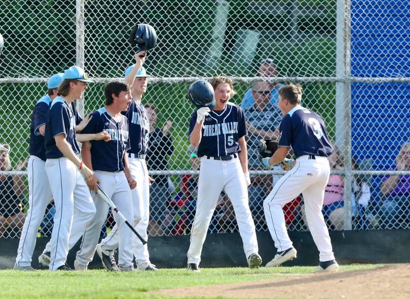 BV senior Layton Britt (3) finds a welcoming party after belting one of two home runs in Thursday's 5-4 regional semifinal win over Riverdale Thursday.