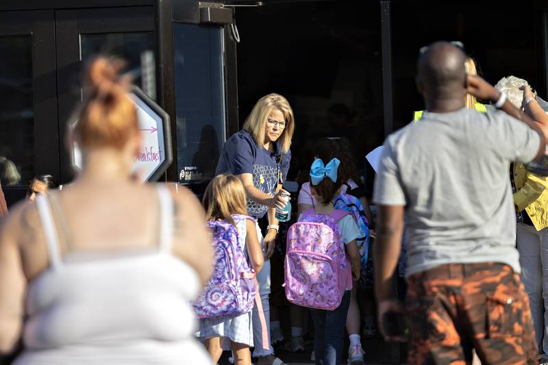 Students filing into Jefferson School in Sterling Thursday, August 14, 2025, get a spritz of hand sanitizer to start off the first day of school for the 2025-26 year.