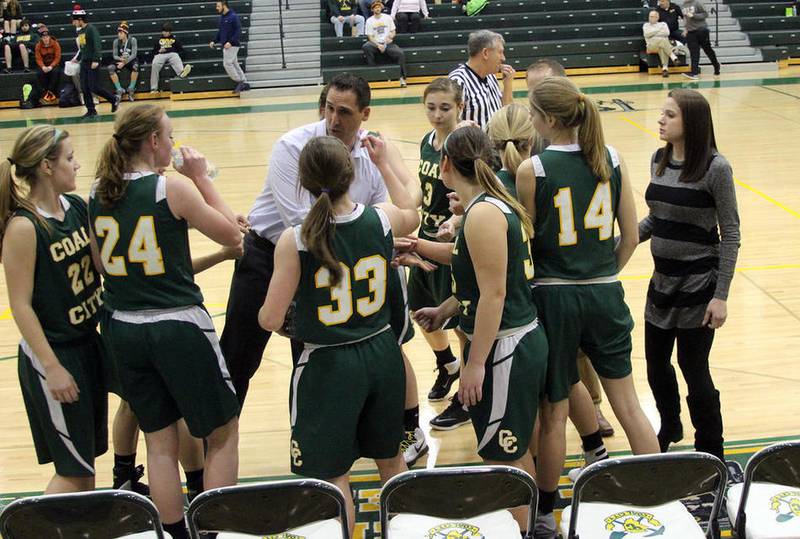 Coal City girls basketball coach Brad Schmitt instructs his team during a timeout in a 34-19 loss to Peotone in the Interstate Eight Conference Tournament on Monday night.