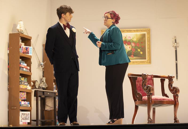 Owen Winters, as Victor Winslow and Falan Schwarz, as Lila Lamont, rehearse a scene for Dixon High School’s rendition of “Thirteen Past Midnight” Wednesday, Oct. 30, 2024.