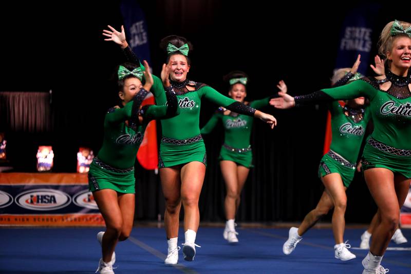 Members of the Providence Catholic cheerleading team compete in the medium team division of the IHSA State Finals on Saturday, Feb. 8, 2025 at Grossinger Motors Arena in Bloomington.