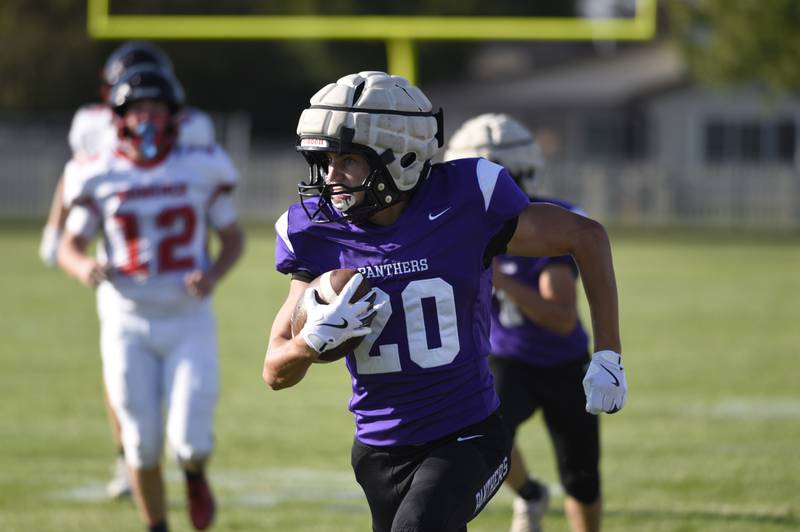 Manteno's Briggs Cann carries the ball on a play in a scrimmage game against Momence on Friday, August 22, 2025.
