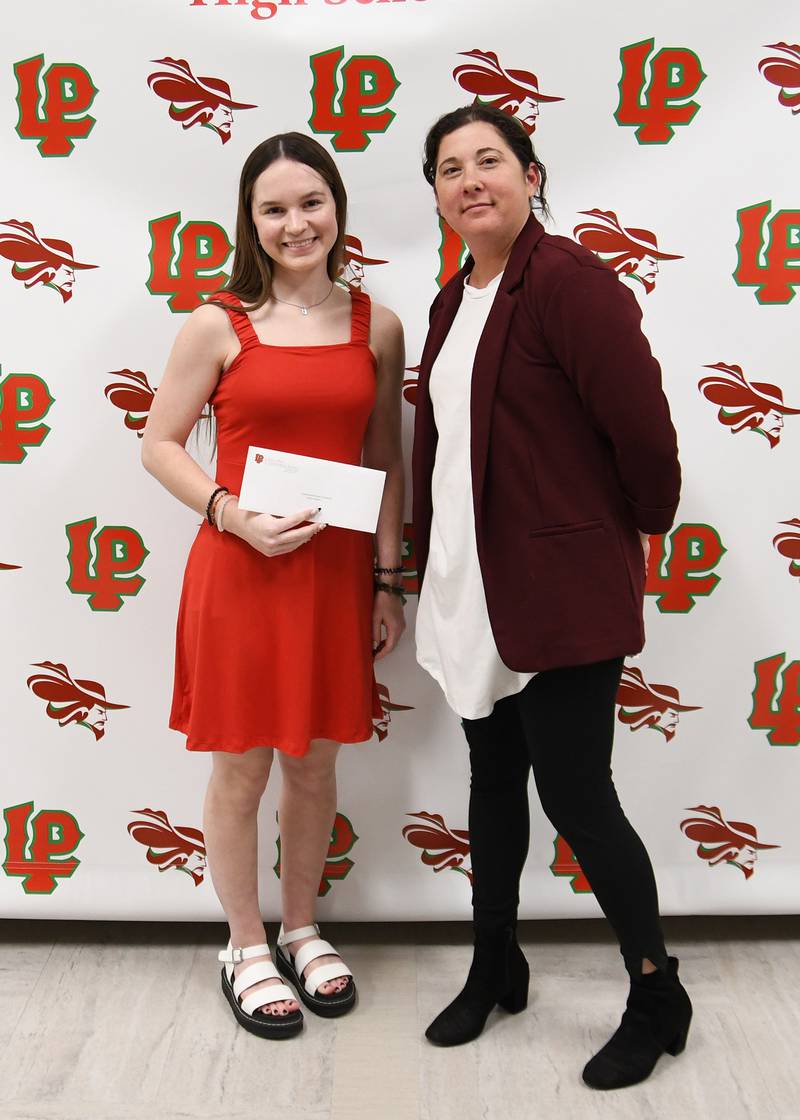 Reena Stevens (left) received the Central Bank Illinois Scholarship. This scholarship is awarded to an La Salle-Peru High School senior who has a minimum 3.0 cumulative GPA after seven semesters and has been accepted to a college. The scholarship was presented by Jennifer Konczak (right).