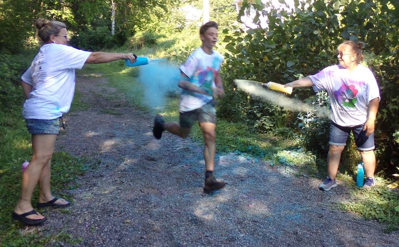 Runners were greeted with colored powder at the finish line of the Safe Journeys first Color Run on Saturday, Aug. 6, 2022, at Twister Hill Park in Streator.