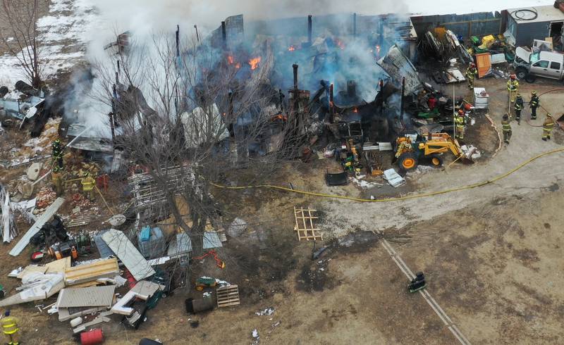 Firefighters extinguish flames from a structure fire in the 4000 block of East 16th Road on Thursday, Feb. 5, 2026 near Earlville. Fire departments from Serena, Mendota, Troy Grove and others were dispatched shortly after 12p.m. to the fire. The fire was upgraded to the second alarm through the Mutual Aid Box Alarm System (MABAS 25) shortly after.