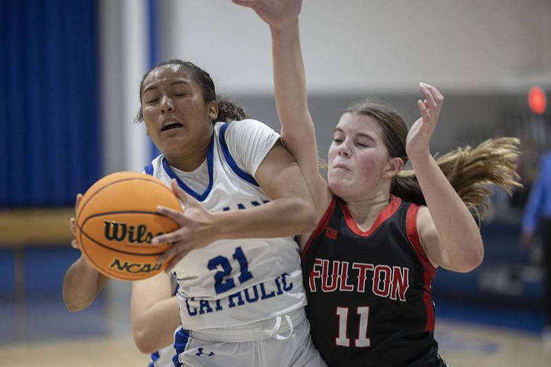 Newman’s Gisselle Martin against Fulton’s Ella Folk Tuesday, Nov. 25, 2025.