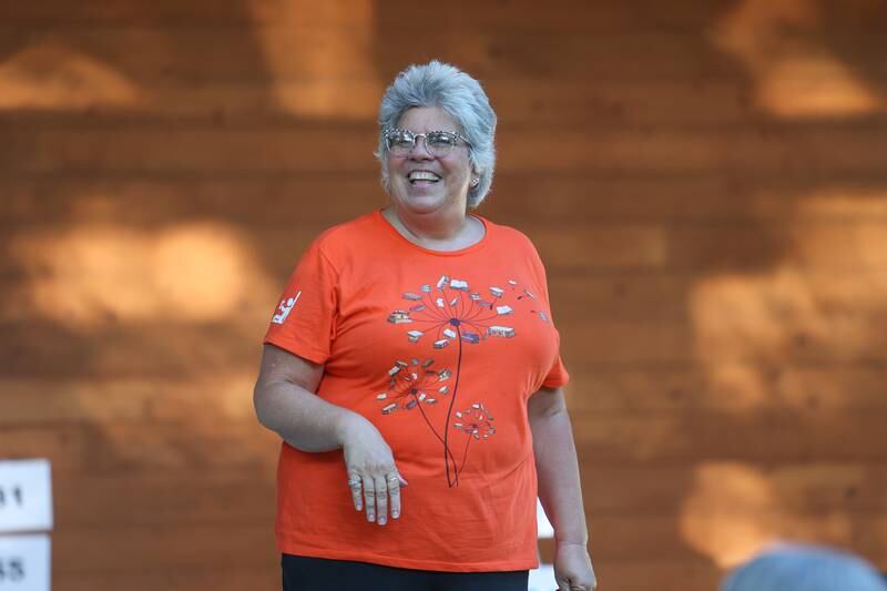 Resa Mai, Morris Library Director, introduces the GreenRoom Improv group hosted by the Morris Library at Goold Park on Friday, Aug. 11, 2023 in Morris.
