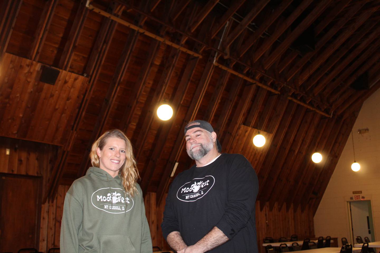Bridget Brown (left), owner of The Copper Cow in Mount Carroll, and manager Michael Pierce are organizing this year's MooFest in Mount Carroll – a four-day event from May 22-25 with live music, games, a 5K race, and cookouts that helps continue a longtime town tradition alive. Brown organized the first MooFest in 2024. "The one thing that I heard when I was out here was that I had to be here for Memorial Day weekend," Brown said. "You had to be there. That's their big thing. That's all everyone talked about, was that Mayfest was the one weekend where everyone comes home and spends time with each other. We are trying to keep that whole community aspect of it, and give everyone a place to go and something to do."
