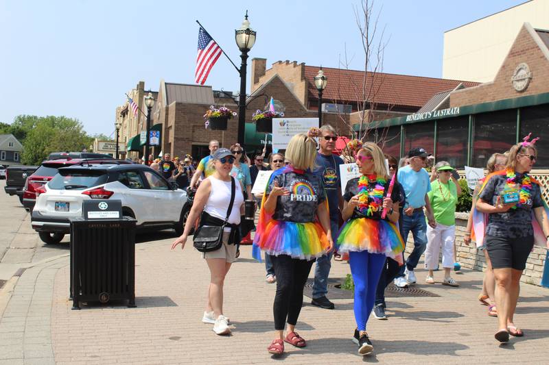 Attendees of the 2nd annual Crystal Lake Pride Walk & Social dressed in rainbow attire on June 1, 2025.