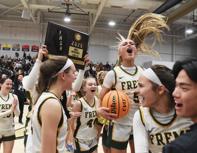 Fremd players including Ellie Thompson (with ball) celebrate their 67-47 victory over Glenbard West during the Hersey Class 4A supersectional at Forest View Education Center on Monday, March 3, 2025 in Arlington Heights.