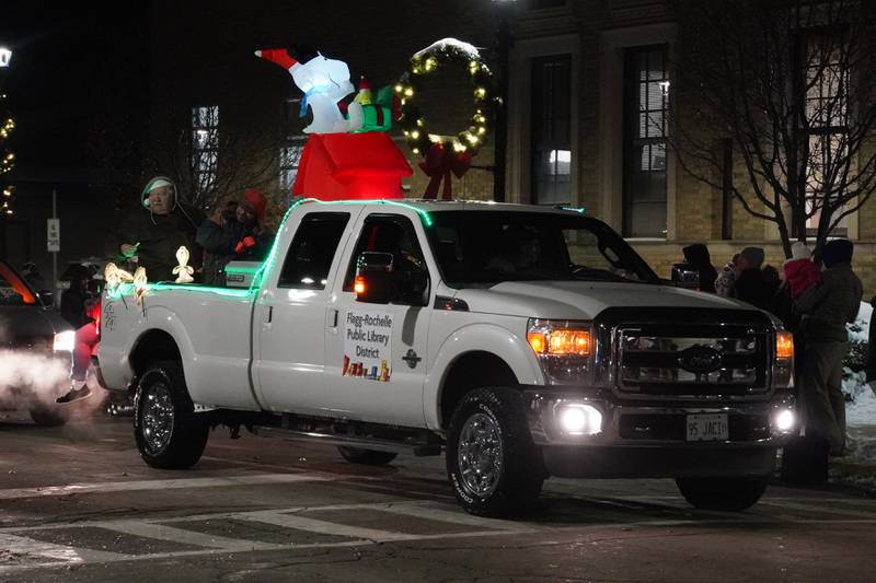The Flagg-Rochelle Public Library's float rides in Rochelle's lighted Christmas parade on Friday, Dec. 5, 2025.
