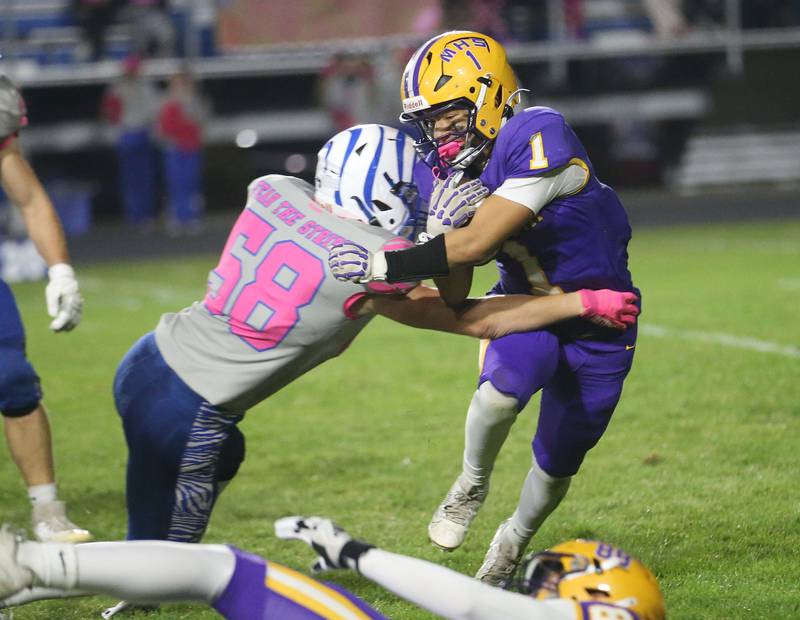 Mendota's Javier Hernandez is stopped at the line of scrimmage by Princeton's Andrew Giaquinto on Friday, Oct. 10, 2025 at Bryant Field in Princeton.