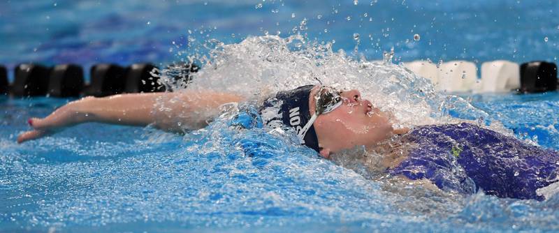 Dundee-Crown’s Rachel Johnson swims backstroke in the 200-yard individual medley during the girls state swimming preliminaries at the FMC Natatorium on Friday, Nov. 14, 2025 in Westmont.