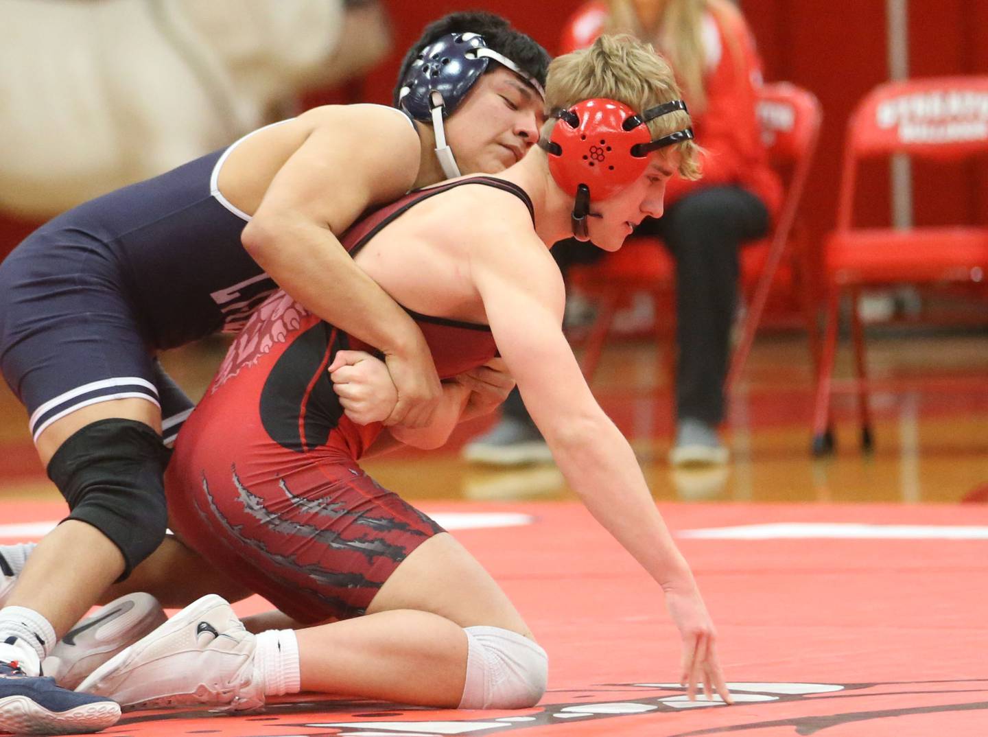 Lisle's Johnny Consuegra (at left) wrestles Streator's Carter Heider on Wednesday, Jan. 21, 2026, in Streator's Pops Dale Gymnasium.