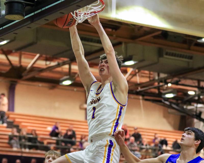 Downers Grove North's Jake Riemer (1) dunks during varsity basketball game between Lyons at Downers Grove North.  Jan 31, 2023.