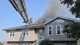 Fire crews battle rapidly spreading porch fire Sunday in Joliet