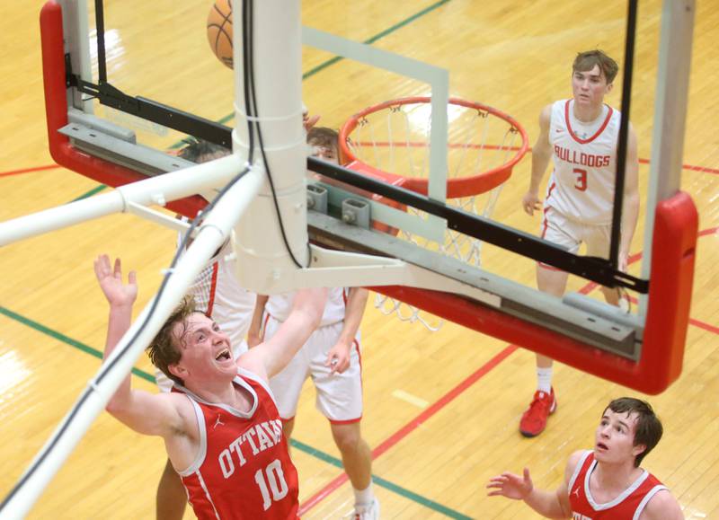 Ottawa's Evan Snook lets go of a shot under the hoop against Streator during the Class 3A Regional semifinal game on Wednesday, Feb. 26, 2025 in Sellett Gymnasium at L-P High School.