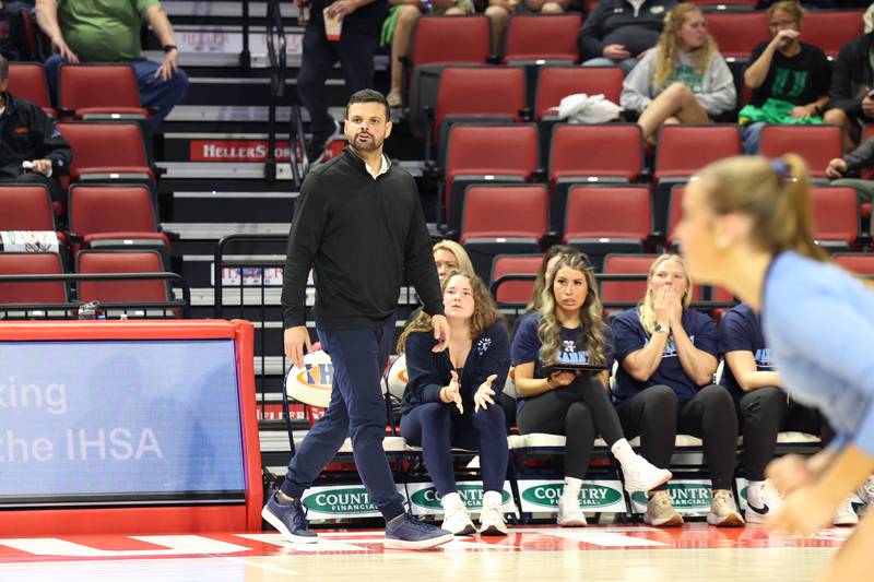 Nazareth head coach Esai Velez watches the game during Nazareth's victory in two sets, 25-16, 25-17, over Providence in the IHSA Class 3A State semifinals on Friday, Nov. 14, 2025.