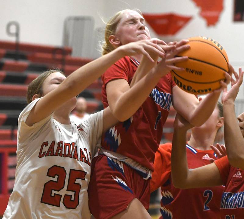 Morrison's Sophie Damhoff (1) rebounds against Forreston's Grace Holaday (25) on Friday, Nov. 21, 2025 at the Forreston High School Girls Basketball Thanksgiving Tournament.