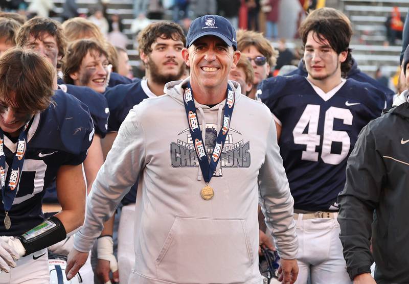 Cary-Grove Head Coach Brad Seaburg smiles after receiving his state champion medal Saturday, Nov. 25, 2023, after their win over East St. Louis in the IHSA Class 6A state championship game in Hancock Stadium at Illinois State University in Normal.