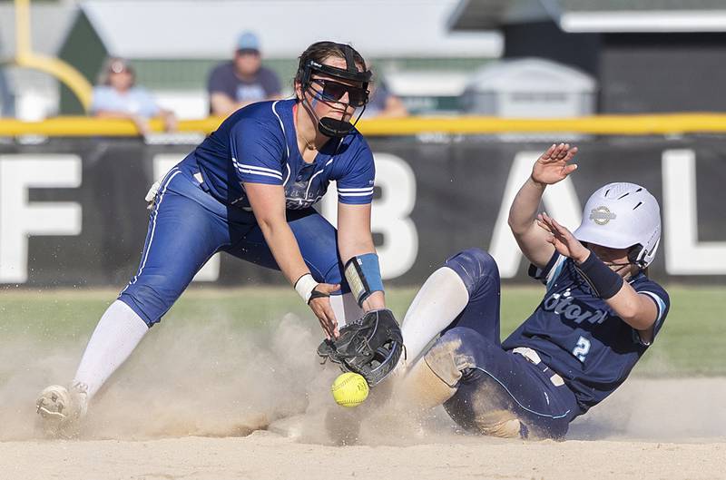 Princeton’s Sylvie Rutledge can’t take the throw as Bureau Valley’s Lesleigh Maynard slide in at second Friday, May 17, 2024 at the Class 2A regional semifinals in Rock Falls.