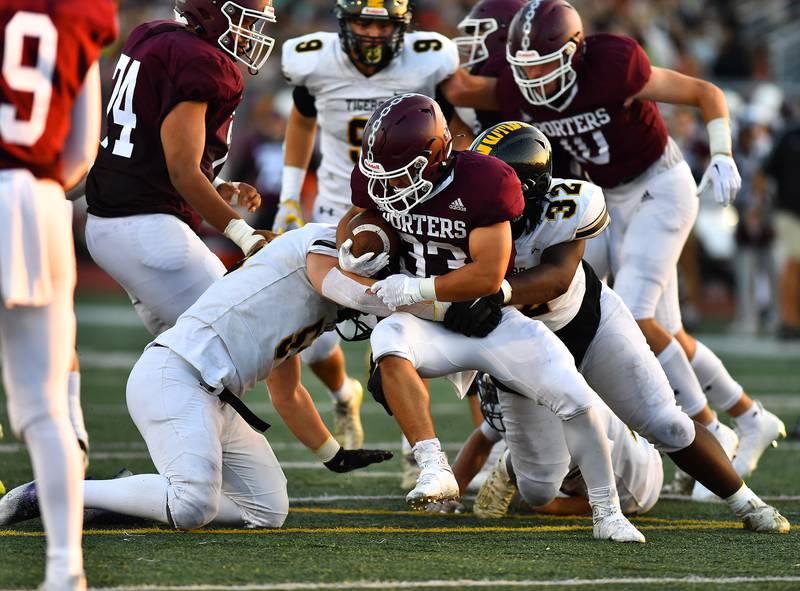 Lockport's Giovani Zaragoza (33) tries to get by two defenders  during the non-conference game between Lockport and Joliet West on Friday, Aug. 26, 2022, at Lockport High School in Lockport.