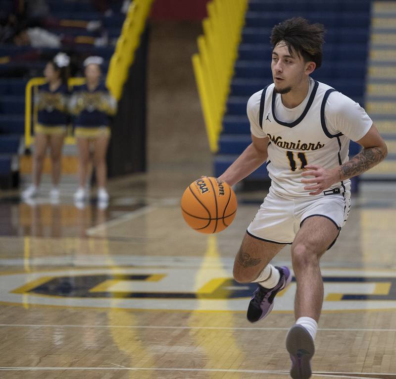 Sterling’s Nico Battaglia handles the ball against St. Viator Monday, Jan. 20, 2025, during Sterling’s MLK Classic.
