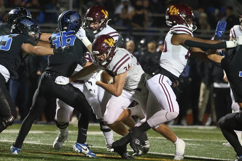 Loyola’s Drew MacPherson finds a gap on a run against Lincoln-Way East in the Class 8A semifinal on Saturday, Nov. 23, 2024 in Frankfort.