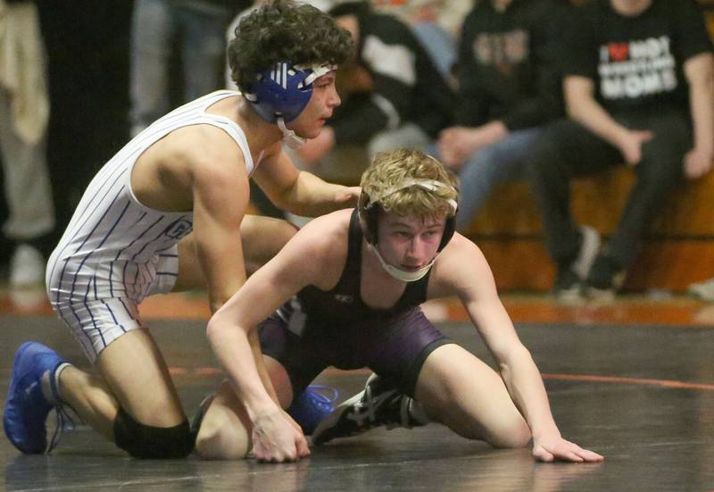 Dixon's Jack Regan (bottom) wrestles Burlington's Eduardo Vences in the 113 weight class during the Class 2A Sectional championship on Saturday, Feb. 15, 2025 at Washington High School.