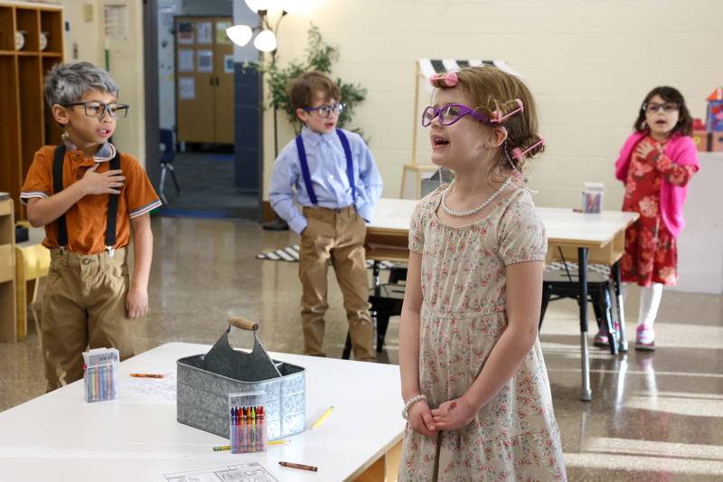 Shabbona Elementary School kindergartener McKenna Bass, center, recites the school's Tiger Mantra with her classmates as they dressed up as 100 year olds for the 100th day of school on Monday, Feb. 9, 2026.