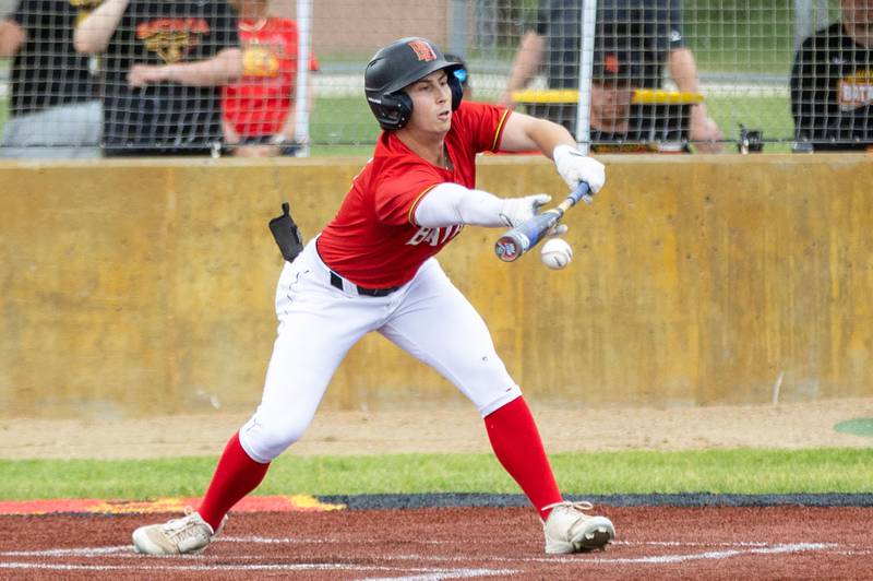Batavia right fielder Nolan Zimberoff bunts during a Class 4A Regional semifinal against St. Charles North at Batavia High School in Batavia on Thursday, May 29, 2025.