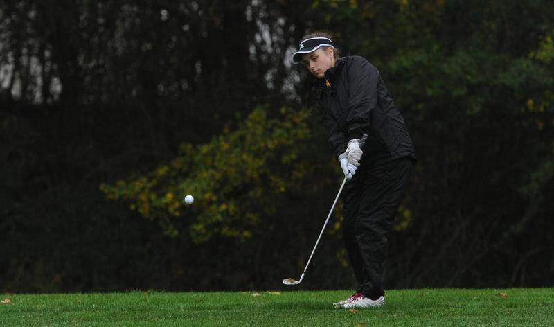 Sycamore's Brianna Chamoun chips in a 35-foot chip shot on the eleventh hole at girls sectional golf held at Randall Oaks Golf Club in West Dundee on Monday.