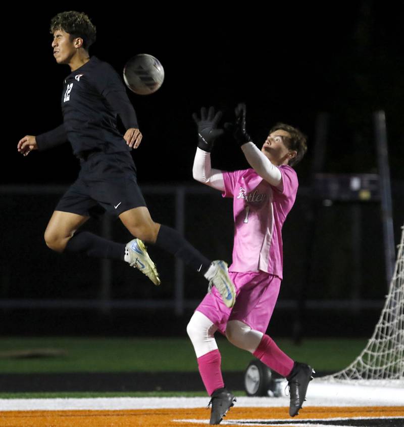 McHenry's Emmanuel Navarrete heads the ball back towards Huntley's Ethan Knaus during a Fox Valley Conference boys soccer match on Thursday, Oct. 9, 2025, at McCracken Field in McHenry.