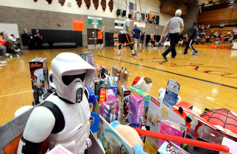 A Star Wars Stormtrooper Scout figure is among toys donated as admission to a charity basketball game between School District 428 middle school staff and DeKalb Guns and Hoses police and fire team Monday December 7, 2015. Attendees were asked to bring toys for the Marine Corps League Toys For Tots. Five large boxes of toys were collected in the first-time event.  Mary Beth Nolan for Shaw Media