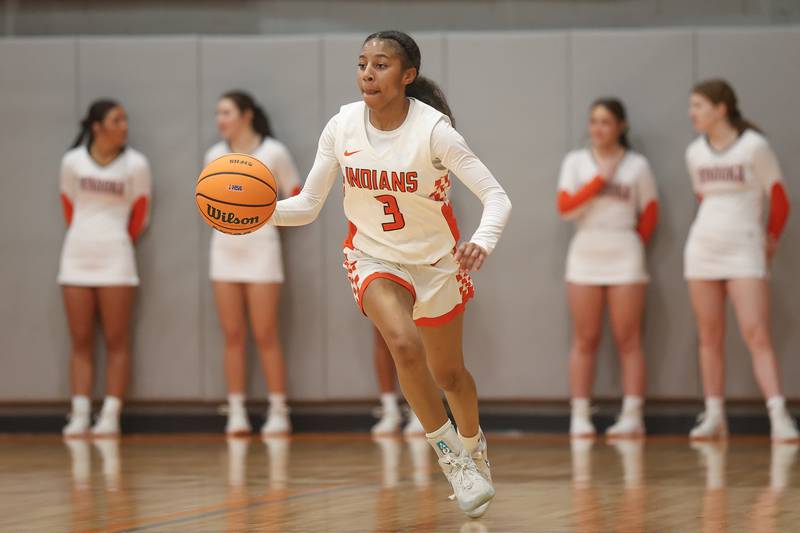 Minooka’s Kendall Thomas works the ball upcourt against Moline in the Class 4A Minooka Regional championship game on Thursday, Feb. 19, 2026 in Minooka.