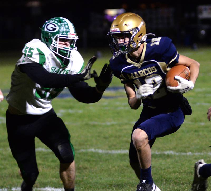 Polo's Billy Lowry (12) runs with the ball as Alden-Hebron's Logan Crowell (55) comes in to tackle during 8-man playoff action on Friday, Nov. 1, 2024 in Polo.